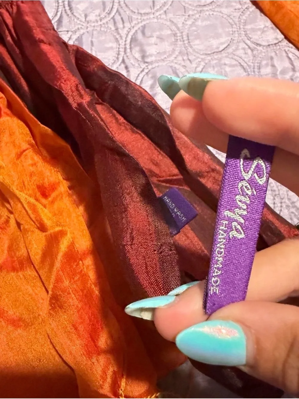 Orange, brown, and teal gradient silk scarf with fringe